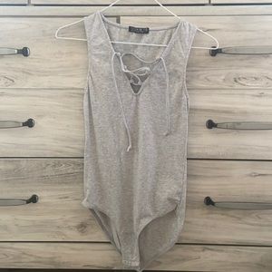Grey criss cross front bodysuit